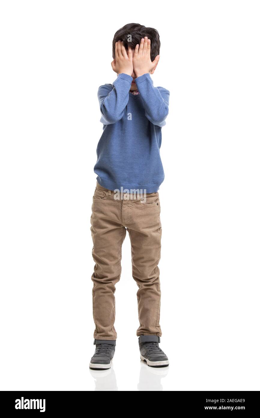 Little boy covering his eyes with hands Stock Photo - Alamy