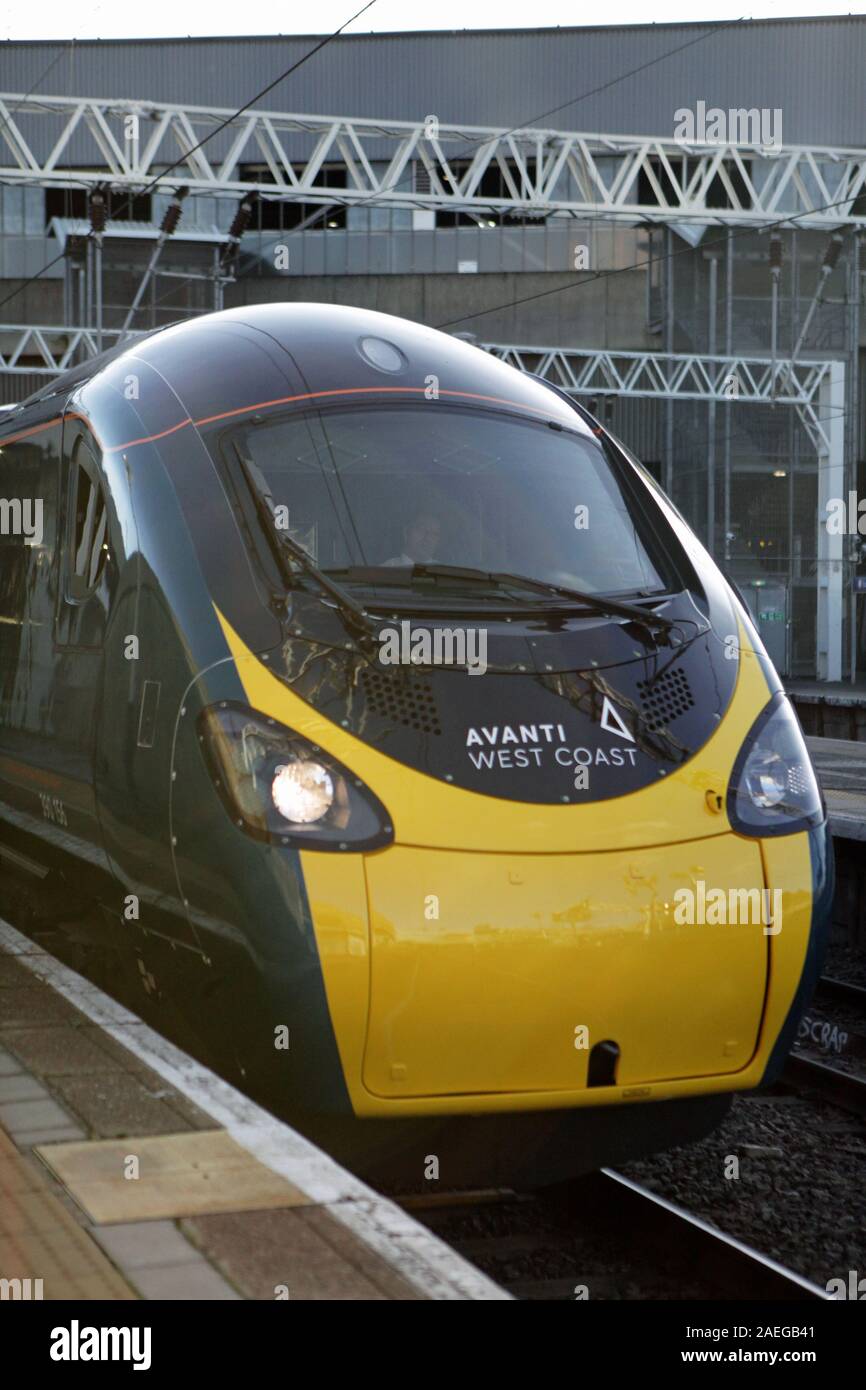 The front of an Avanti West Coast train showing the new logo as it departs from London's Euston Station for its inaugural journey along the West Coast Main Line (WCML). Stock Photo
