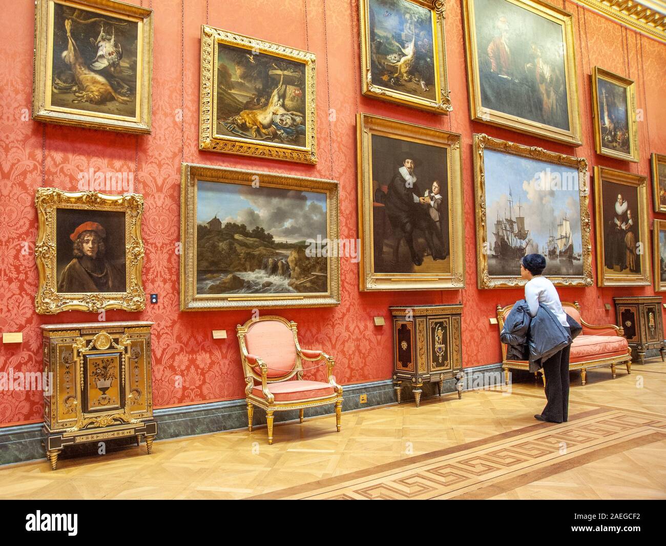 Visitor Looking At Paintings In National Gallery In London, 47% OFF