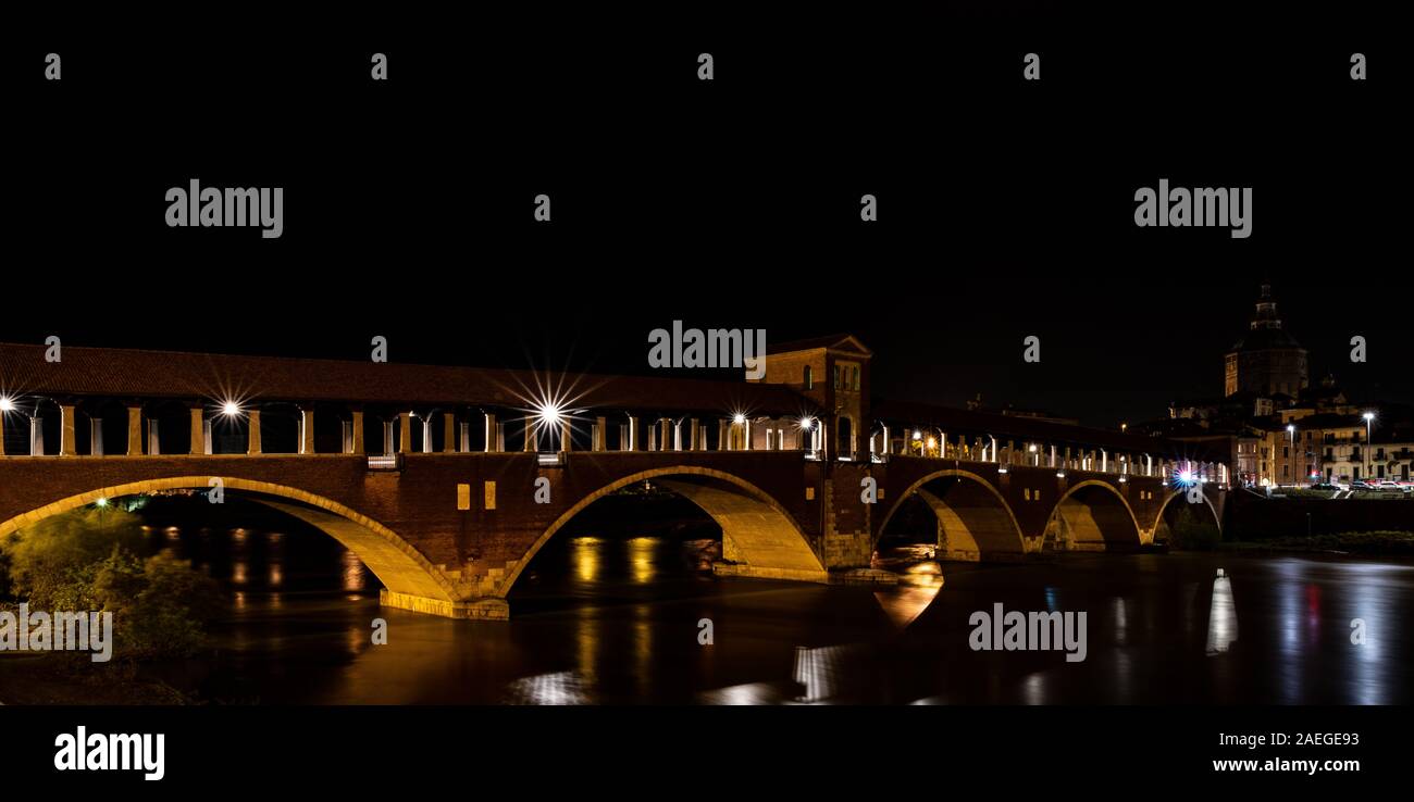 Night photography of the Ponte Coperto of Pavia, historical building also  called Ponte Vecchio built on the Ticino river. Horizontal image of Italian  Stock Photo - Alamy