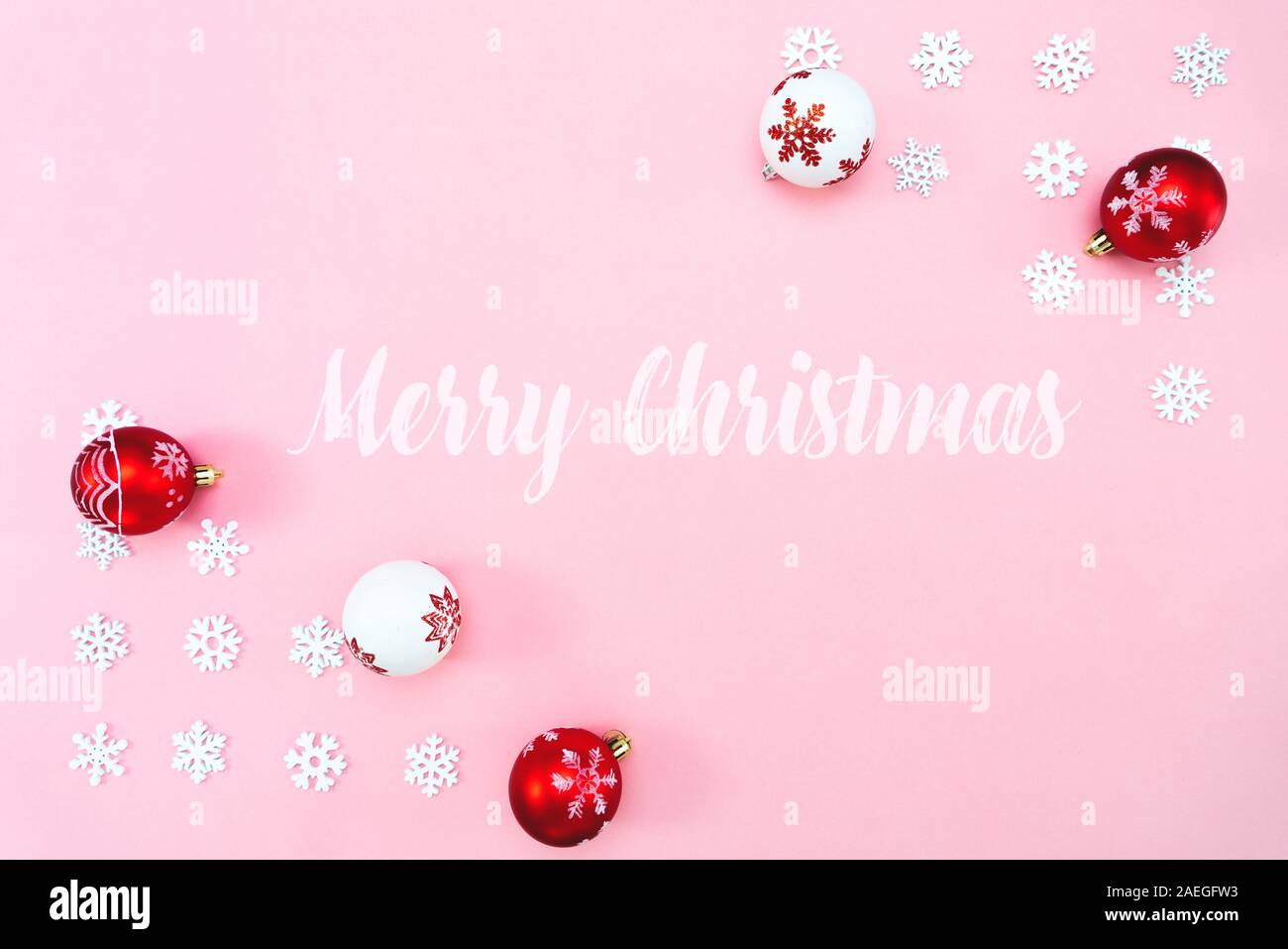 Christmas composition. Christmas balls and snowflakes decorations on pink background. Flat lay, top view, copy space Stock Photo