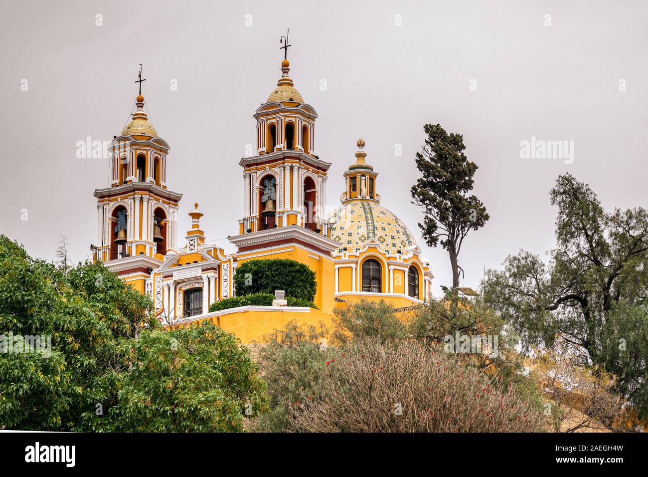 Famous landmark, yellow church - Our Lady of the Remedies sanctuary built on top of the Great Pyramid in Cholula, Puebla, Mexico. Stock Photo