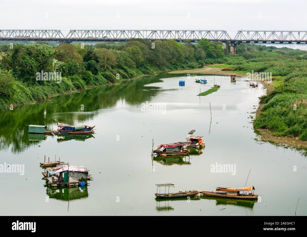 Sampans in Red River with Chuong Duong Bridge, Hanoi, Vietnam, Southeast Asia Stock Photo
