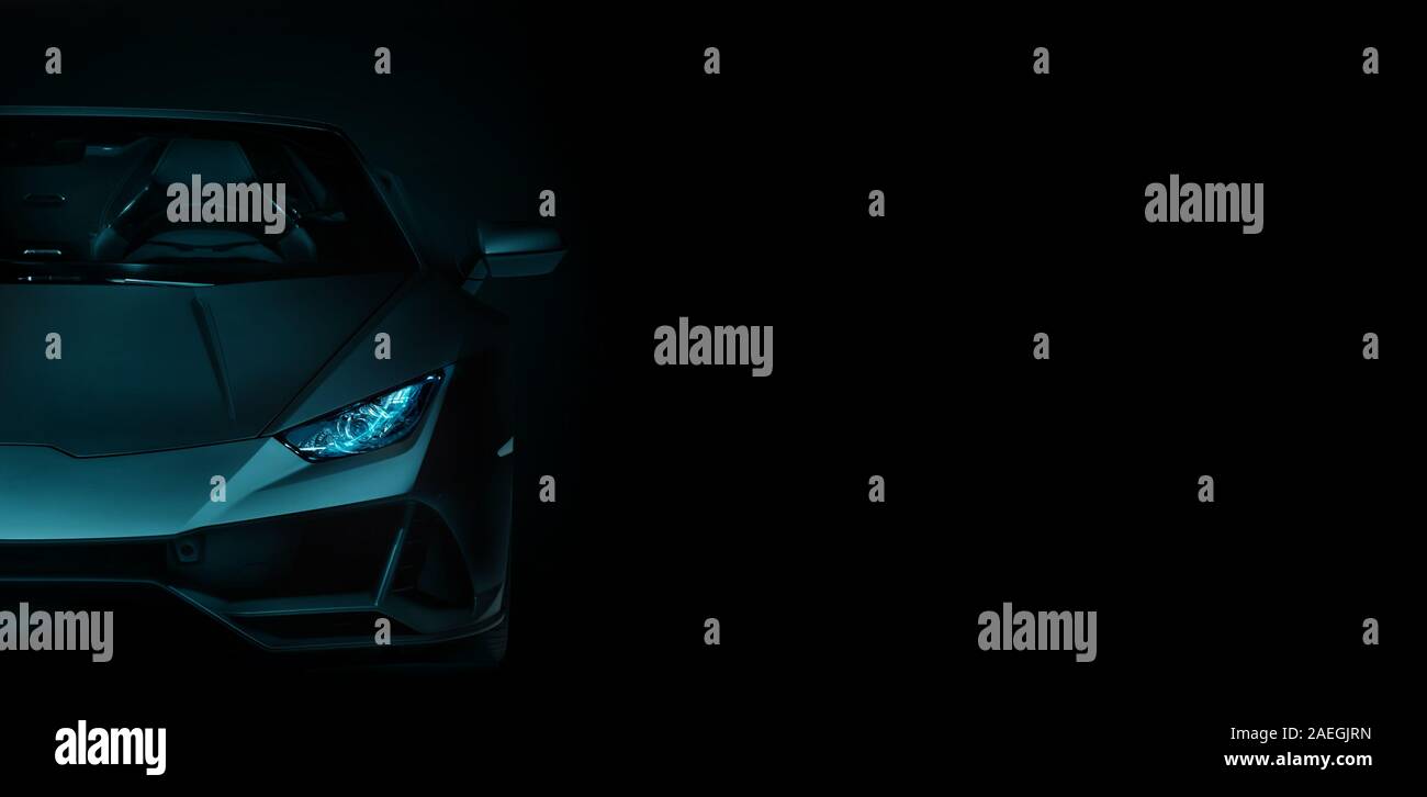 silhouette of black sports car with headlights on black background, photorealistic Stock Photo