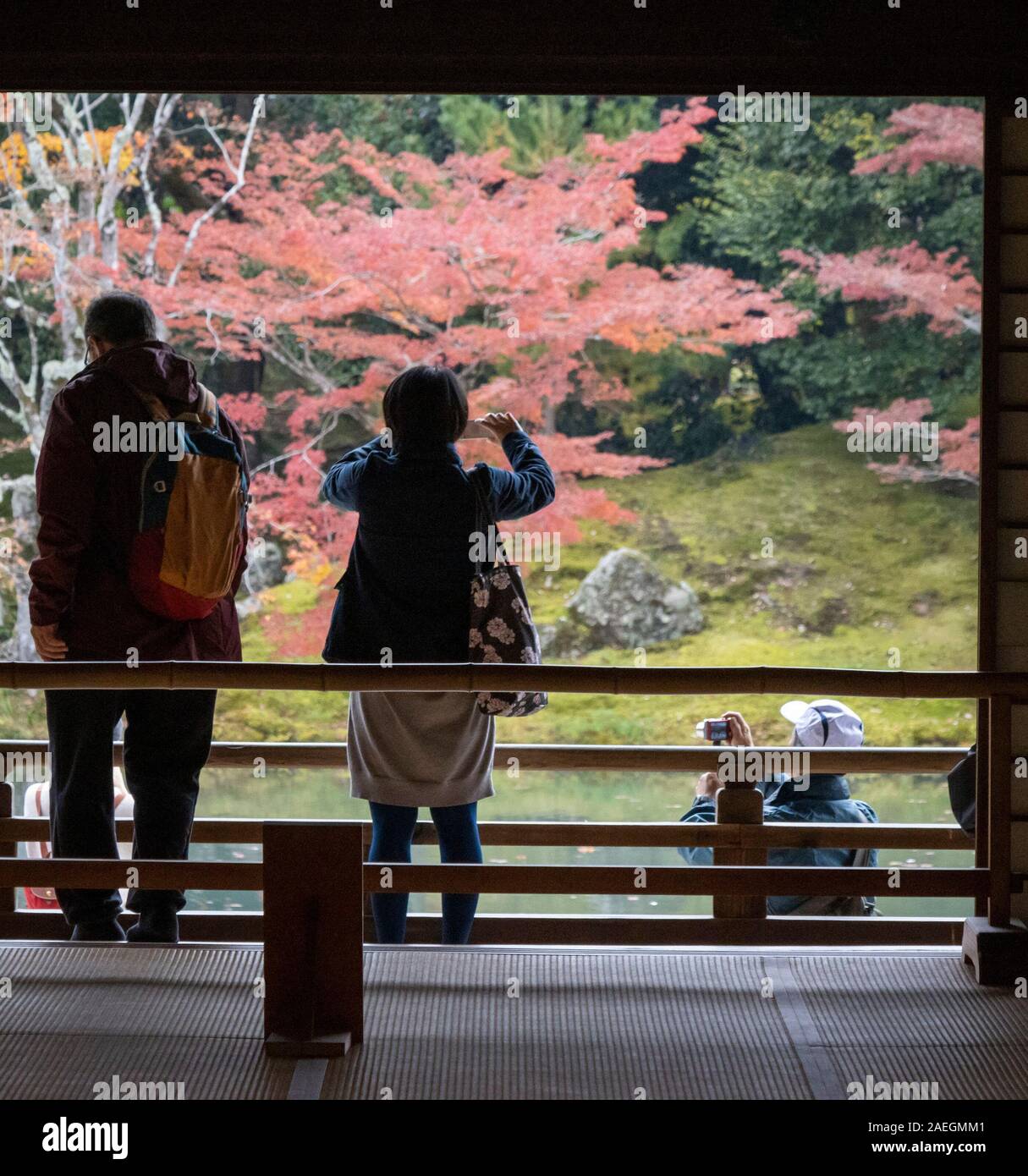 tourists photographing at the Tenryū-ji Zen Buddhist temple, Kyoto, Japan Stock Photo
