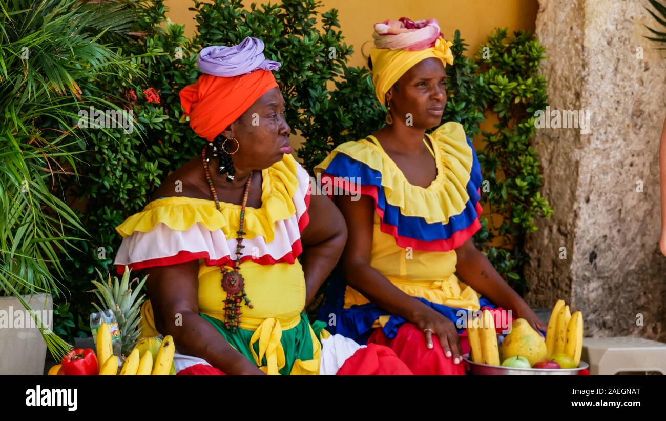 Traditional female fruits street vendor in Cartagena de Indias called Palenqueras Stock Photo
