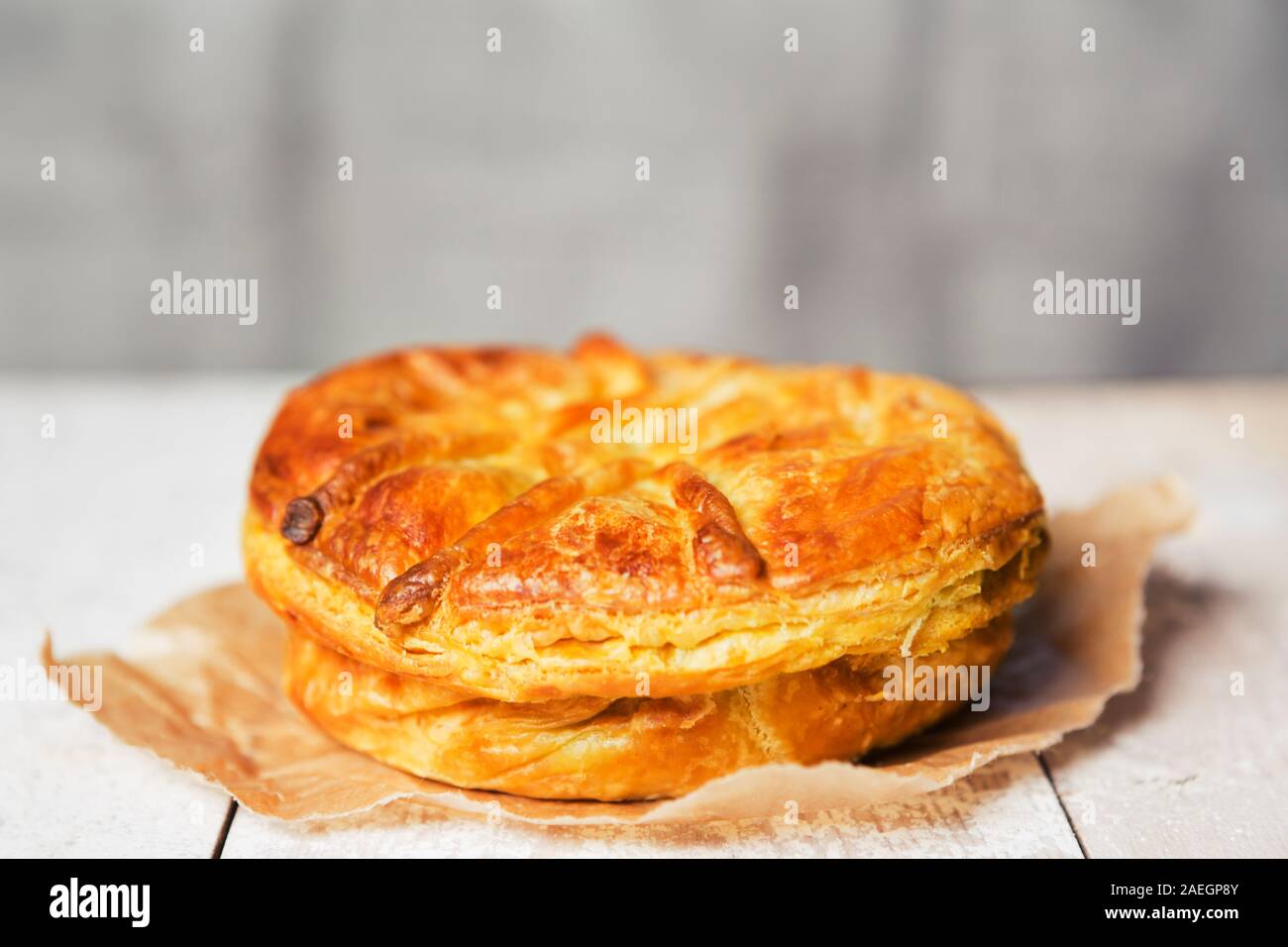 A homemade meat pie on a rustic table. Stock Photo
