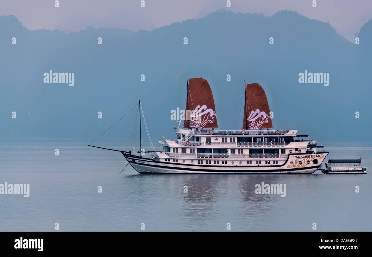 Paradise Peak junk boat with two sails, Halong Bay Vietnam Stock Photo