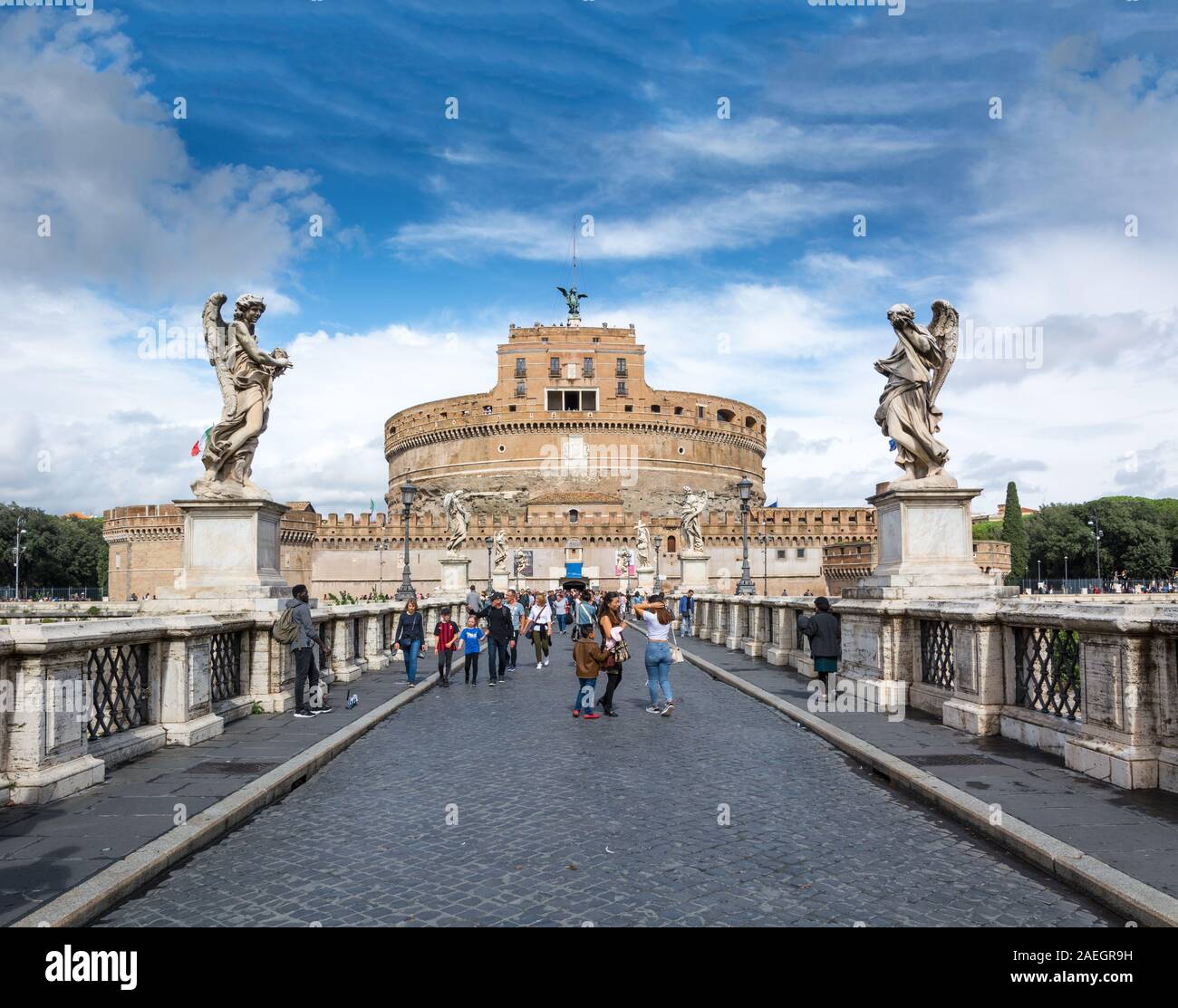 Rome, Italy - Oct 06, 2018: Tourists walking along the bridge of St. Angel, leading to the Castle of the Holy Angel in Rome Stock Photo