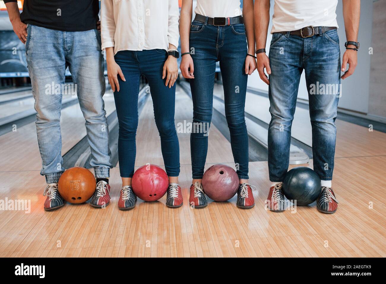 Modern street wear. Cropped view of people at the bowling club ready to have some fun Stock Photo