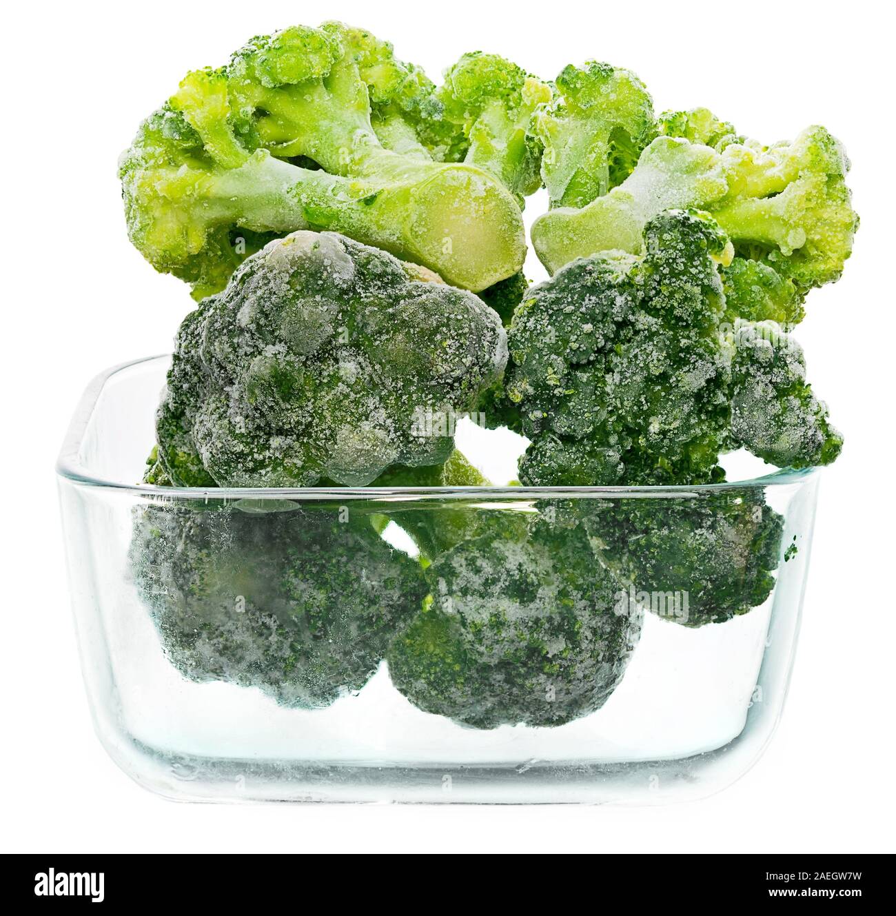 Frozen broccoli in a glass container. Isolation on white background Stock Photo