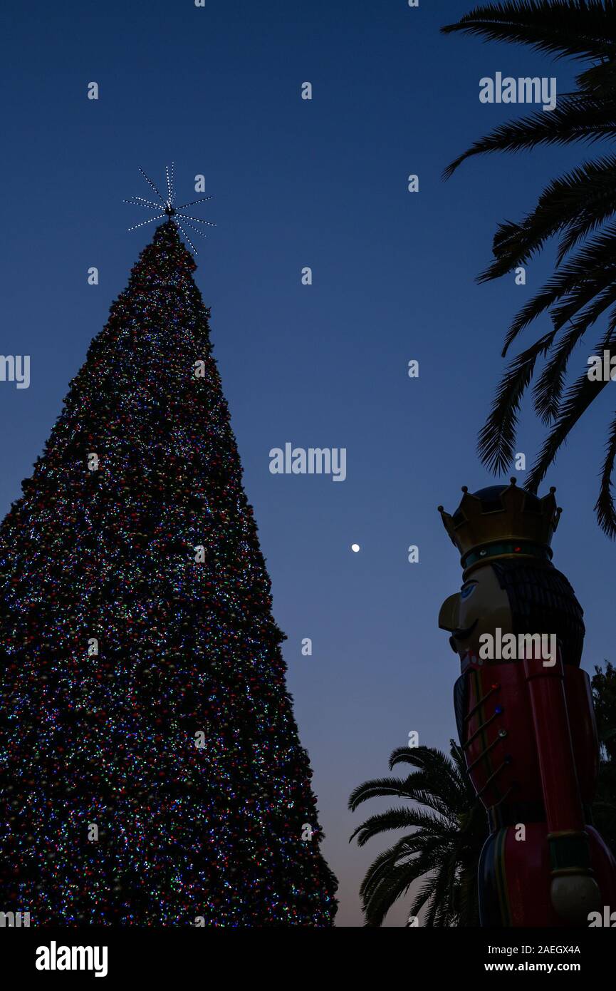 Christmas tree, giant nutcracker, and the moon at Lake Eola Park in