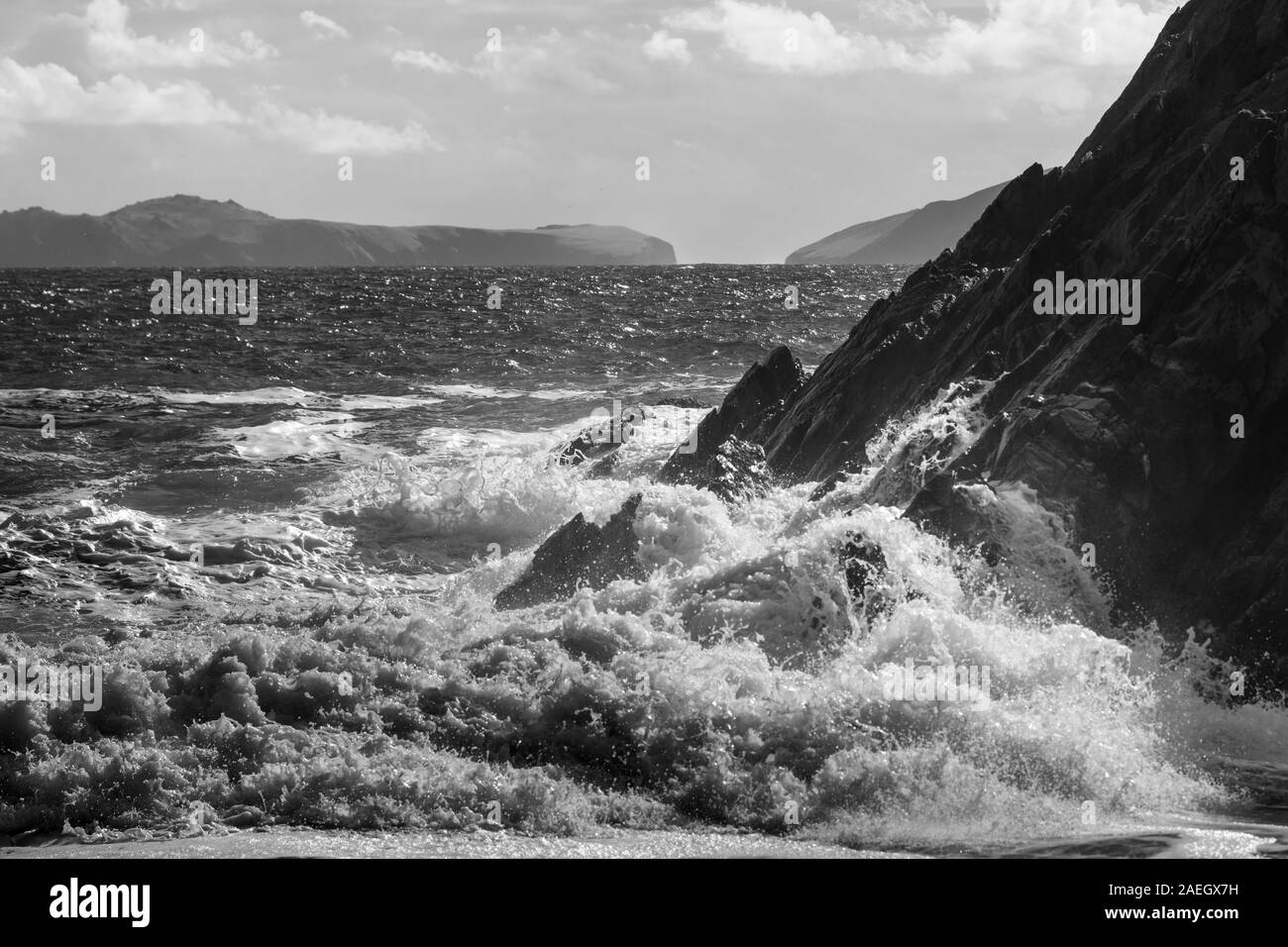 Waves breaking over rocks on the coast, Ballyferriter, County Kerry, Ireland Stock Photo