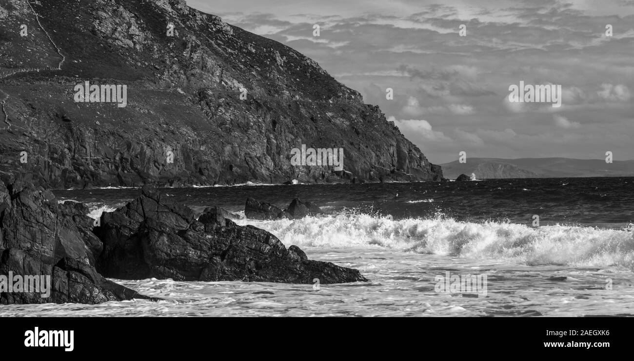 Waves breaking over rocks on the coast, Ballyferriter, County Kerry, Ireland Stock Photo