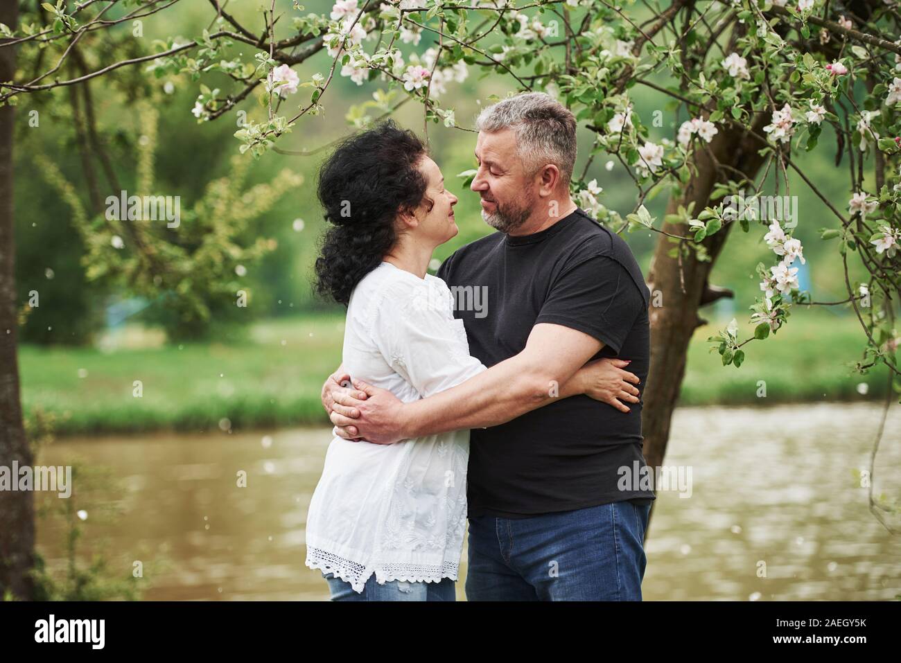 Looking at each other with love. Cheerful couple enjoying nice weekend outdoors. Good spring weather Stock Photo