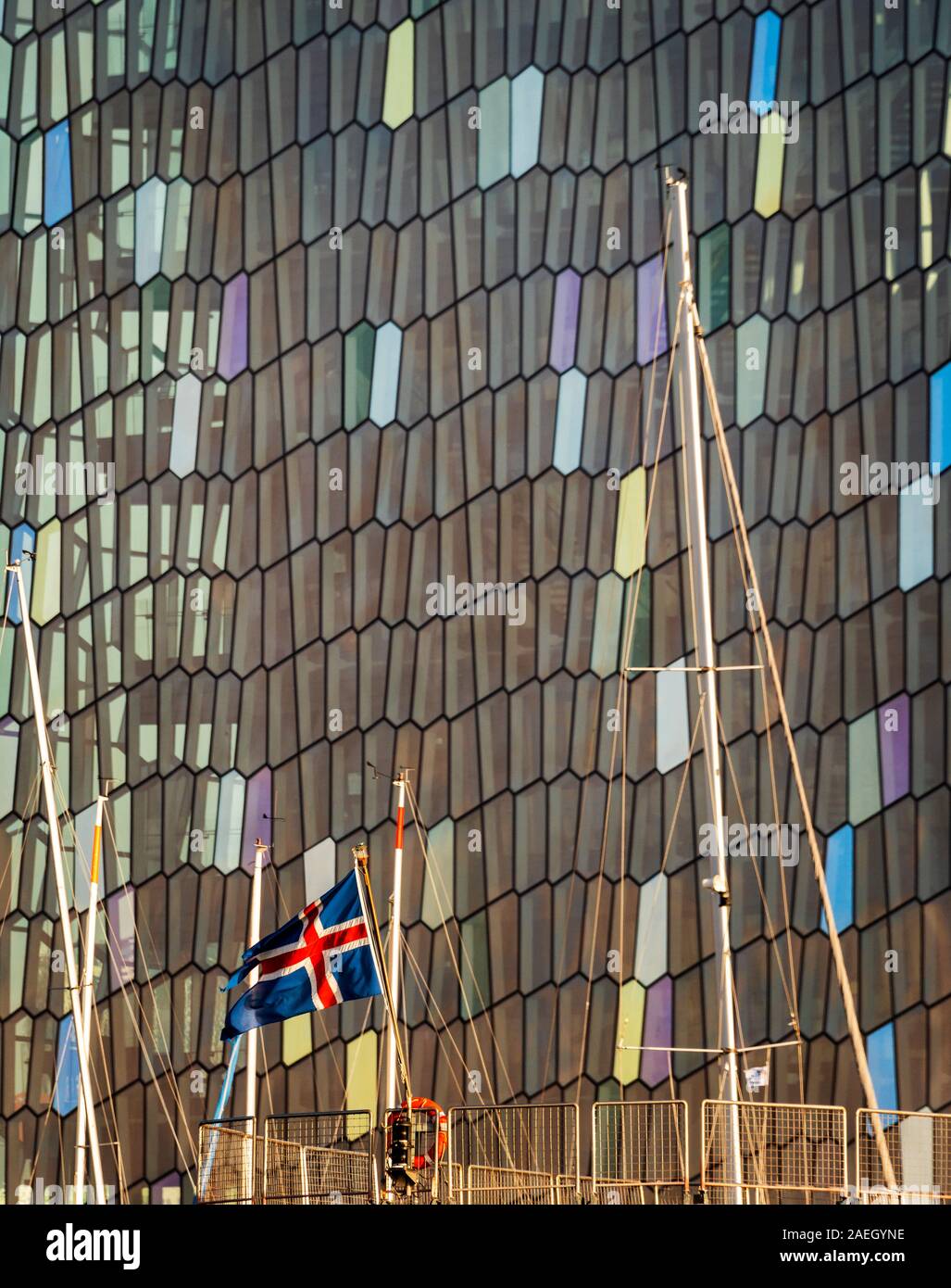 Icelandic Flag with Harpa in the backgrounds, Reykjavik, Iceland Stock Photo