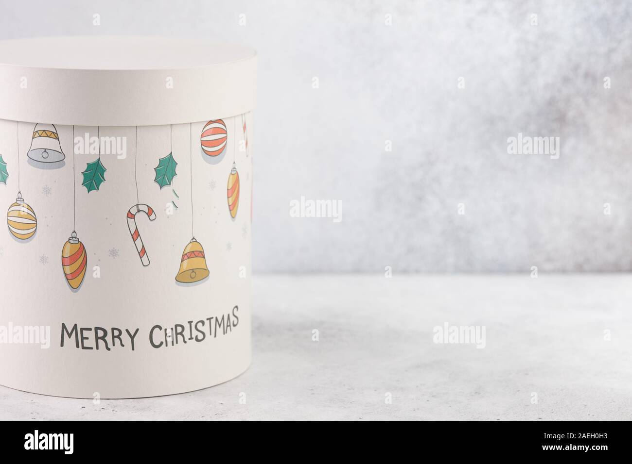Christmas gift box with print on white table, copy space Stock Photo