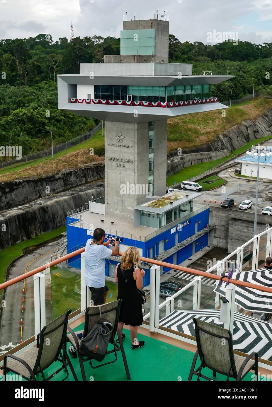 View of Agua Clara locks Control tower (Torre de control). Passengers of cruise ship enjoying the view of Agua Clara locks Stock Photo