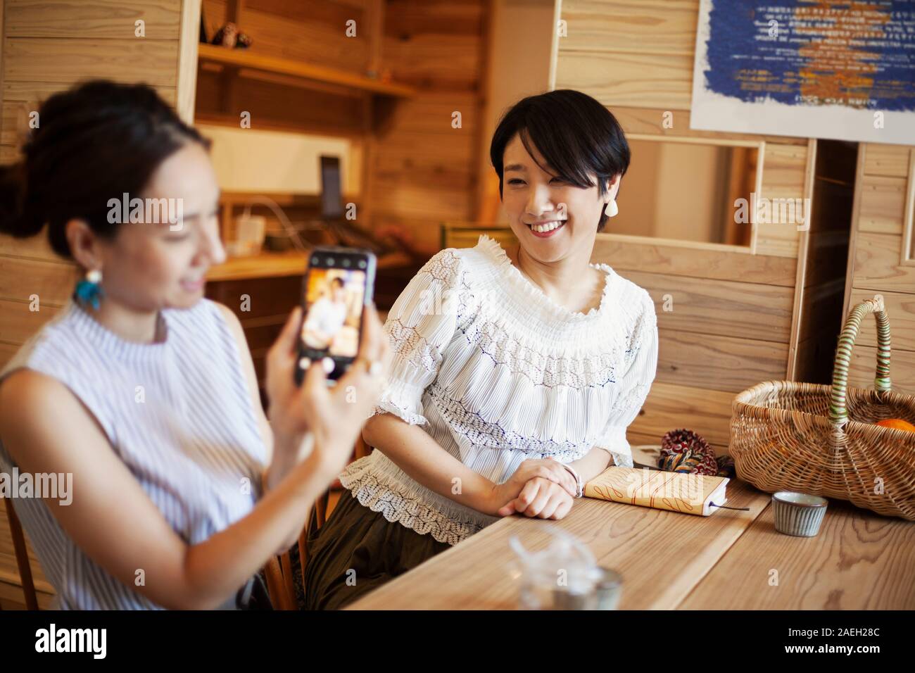 Two japanese women sitting hi-res stock photography and images - Alamy