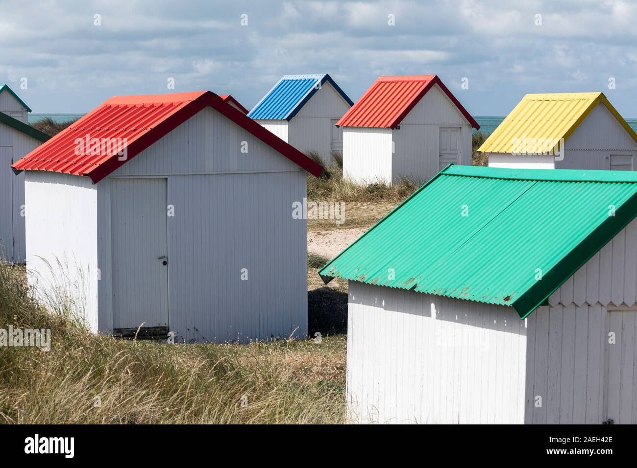 Colourful beach huts at Gouville-sur-Mer, Normandy, France Stock Photo
