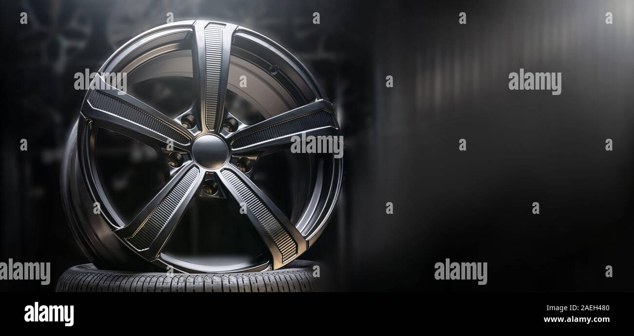 beautiful black alloy wheels made of aluminum on a dark background