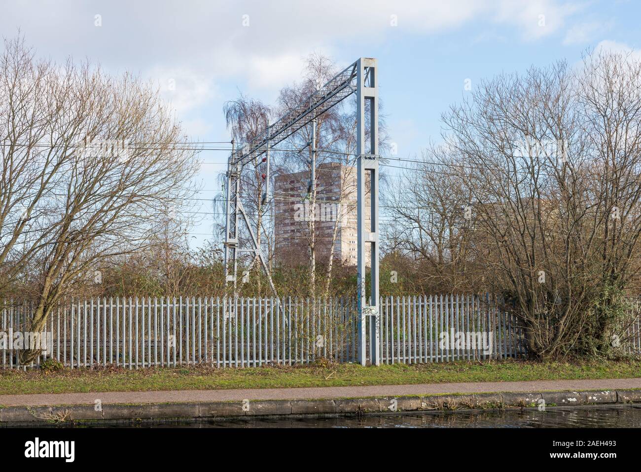Overhead power lines for trains beside the Birmingham Canal Old Line in Ladywood near Birmingham City Centre Stock Photo