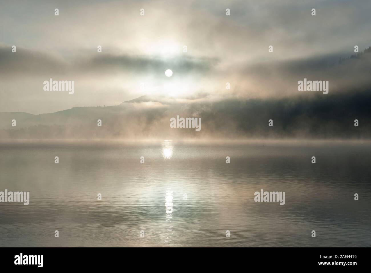 Ground fog above the water, early morning lake at sunrise, Titisee, Germany Stock Photo