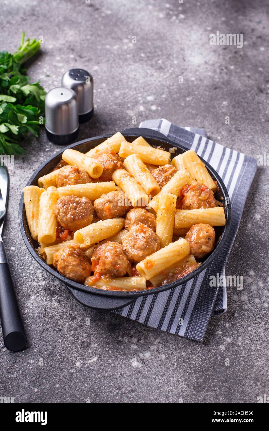 Pasta with meatballs in tomato sauce. Stock Photo