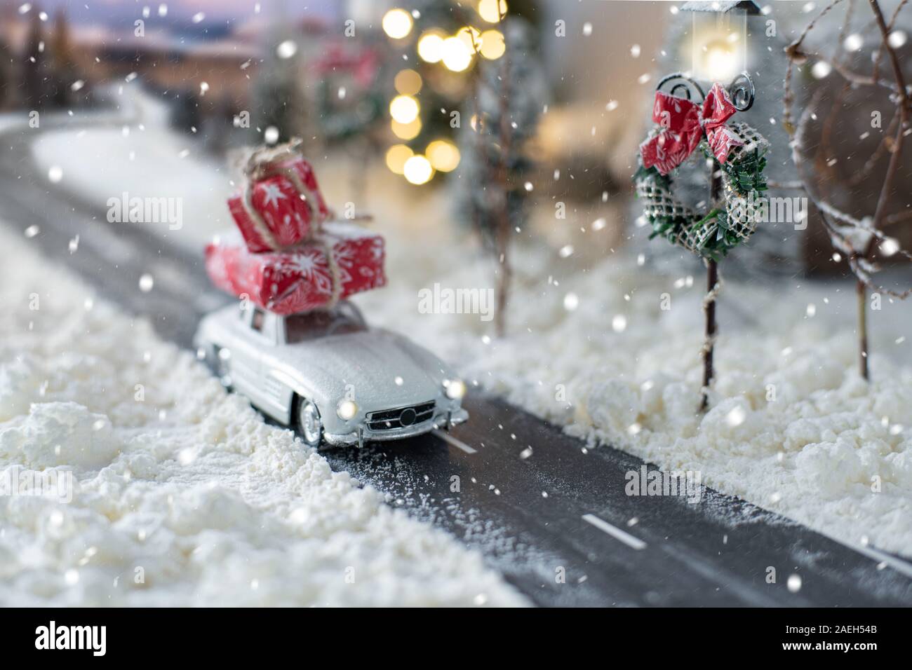 Miniature Classic Car Carrying A Christmas Gifts On Snowy Winter Magic Landscape Stock Photo Alamy