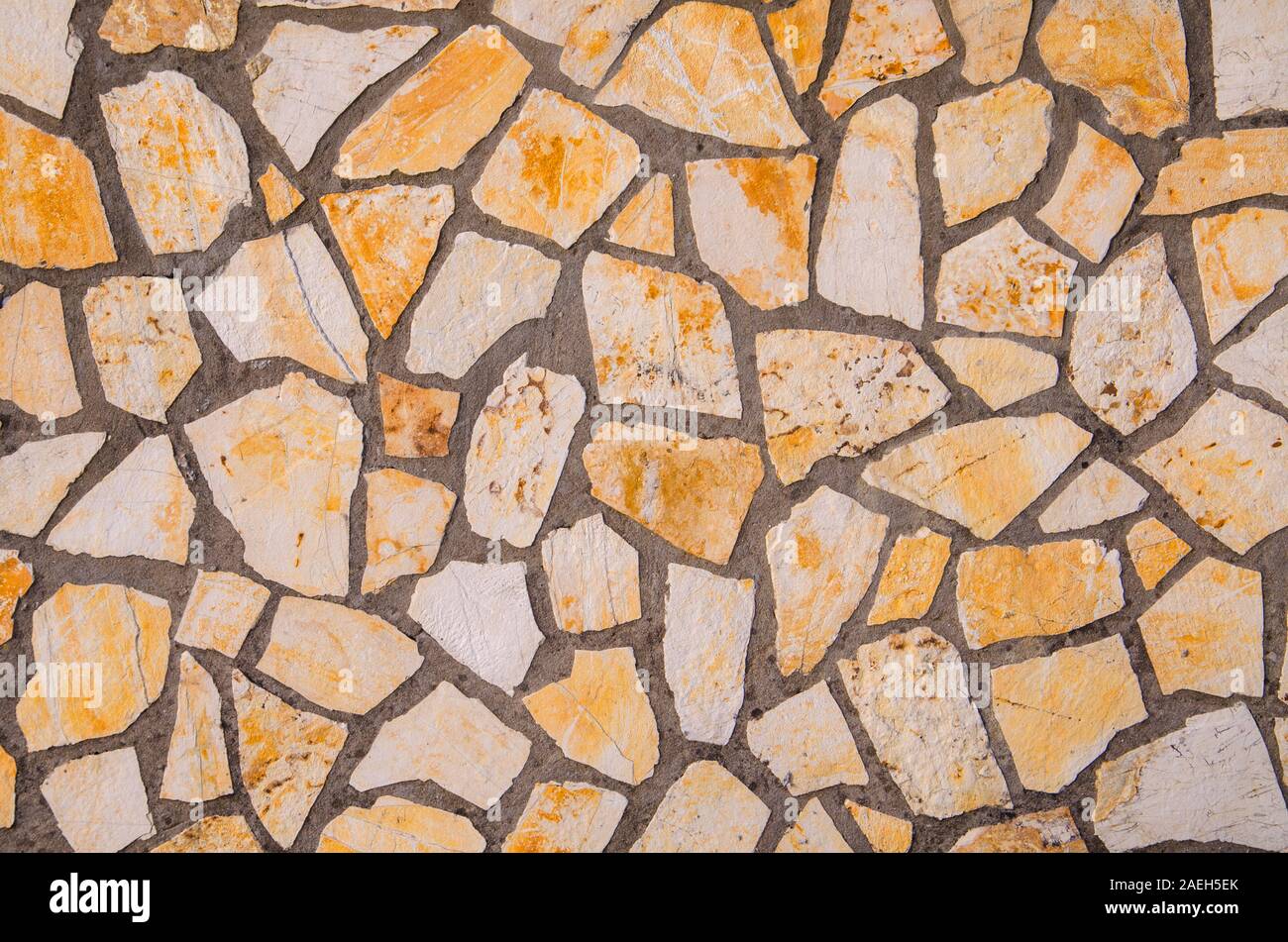 Crazy paving in sandstone with gray cement as a background Stock Photo