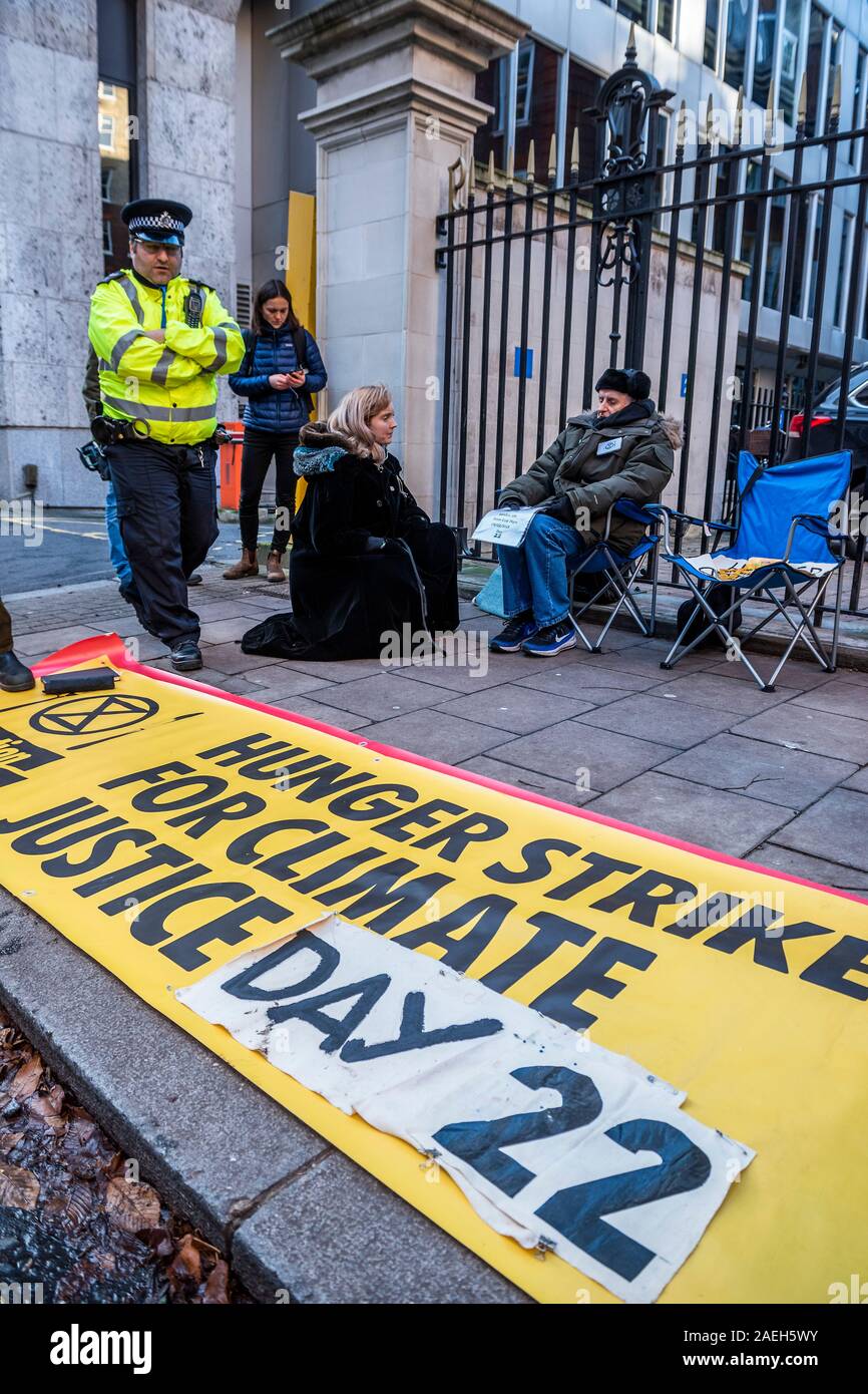 London, UK. 9th Dec, 2019. Lily Cole visits hunger strikers Peter Cole, 76, and Marko, who have been on strike for 21 days, outside CCHQ, in the hope that someone from the Conservative Party would come out and talk to them about their climate goals. So far no-one has come out. Extinction Rebellion's 12 Days of Crisis to ensure the Climate and Ecological Emergency is at the top of the agenda this General Election. Credit: Guy Bell/Alamy Live News Stock Photo