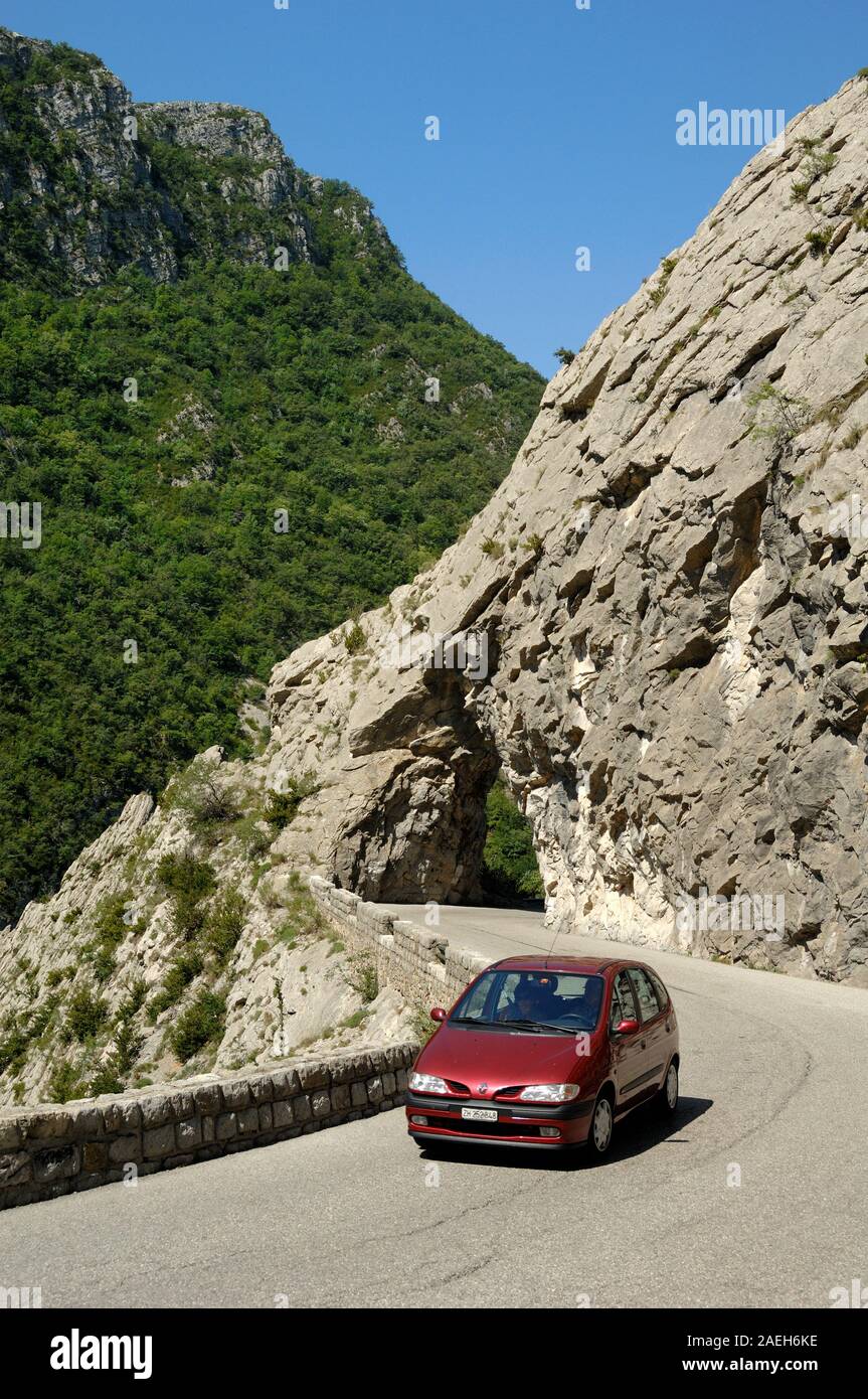 Car Driving Through Clue de Taulanne Canyon or Gorge nr Castellane Alpes-de-Haute-Provence Provence France Stock Photo