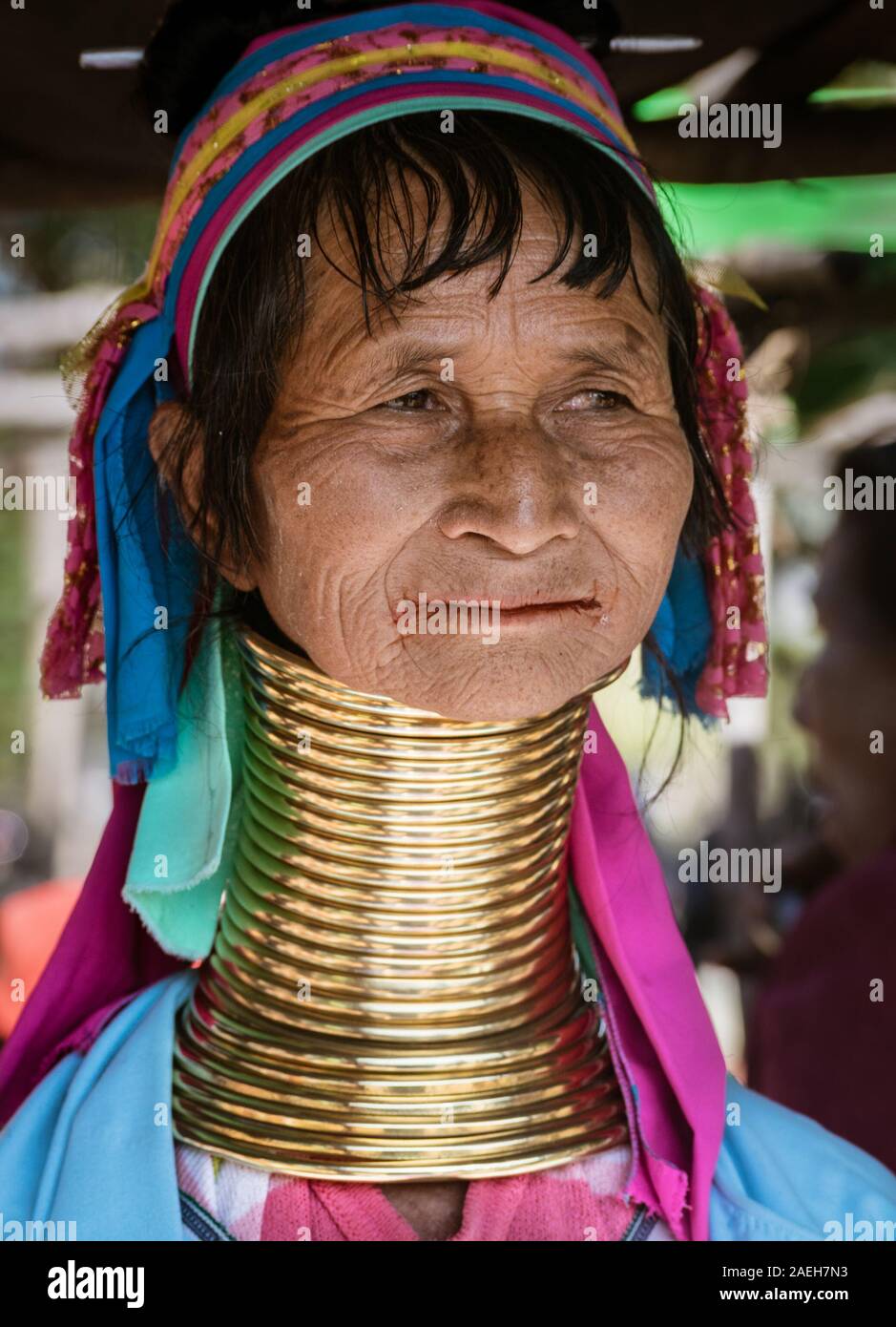 Portrait of an eldery woman from Kayan tribe wearing traditional outfit and brass neck rings in Pan Pet village, Loikaw, Myanmar. Stock Photo