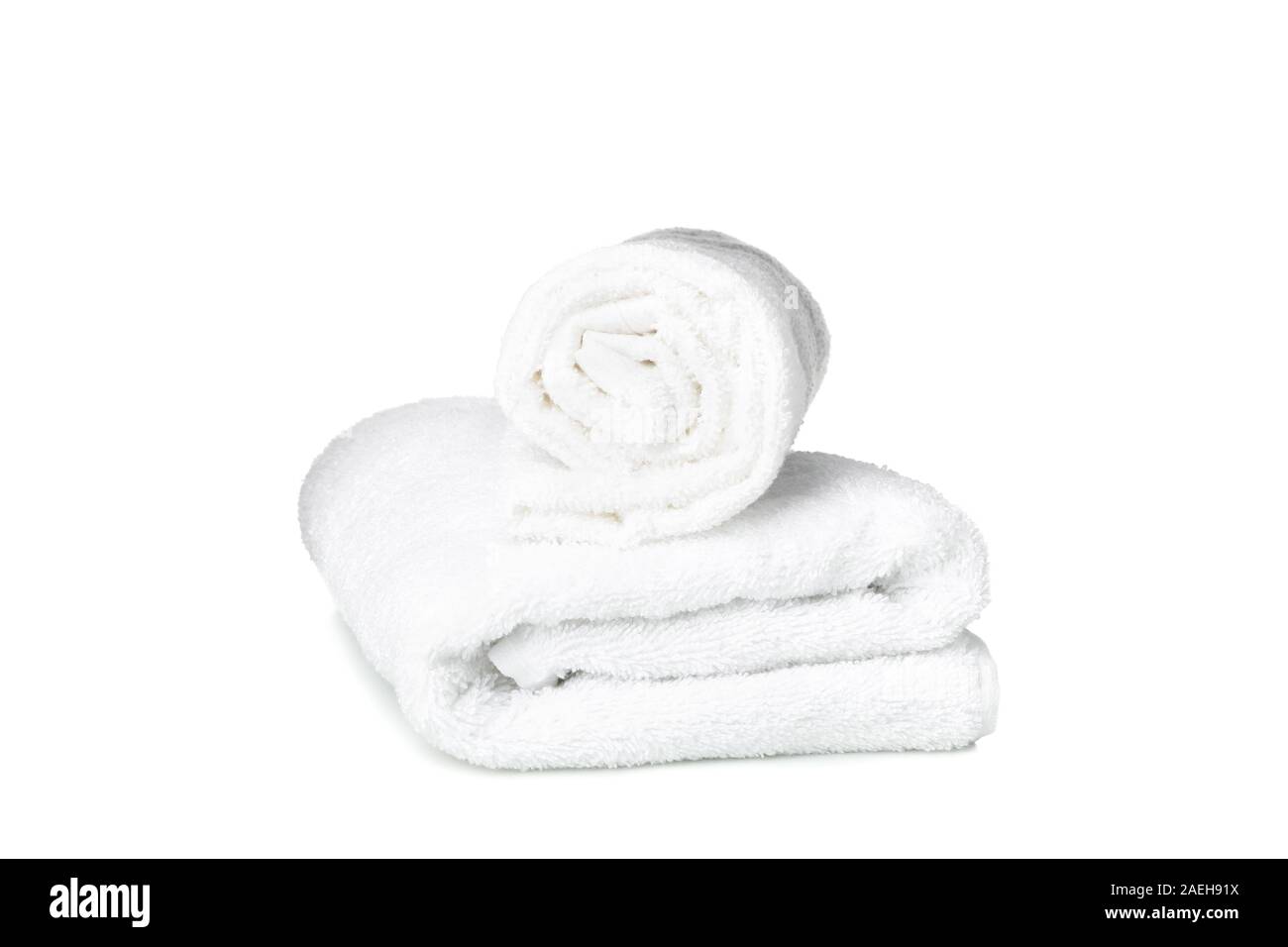 Folded fresh white towels isolated on white background Stock Photo Alamy