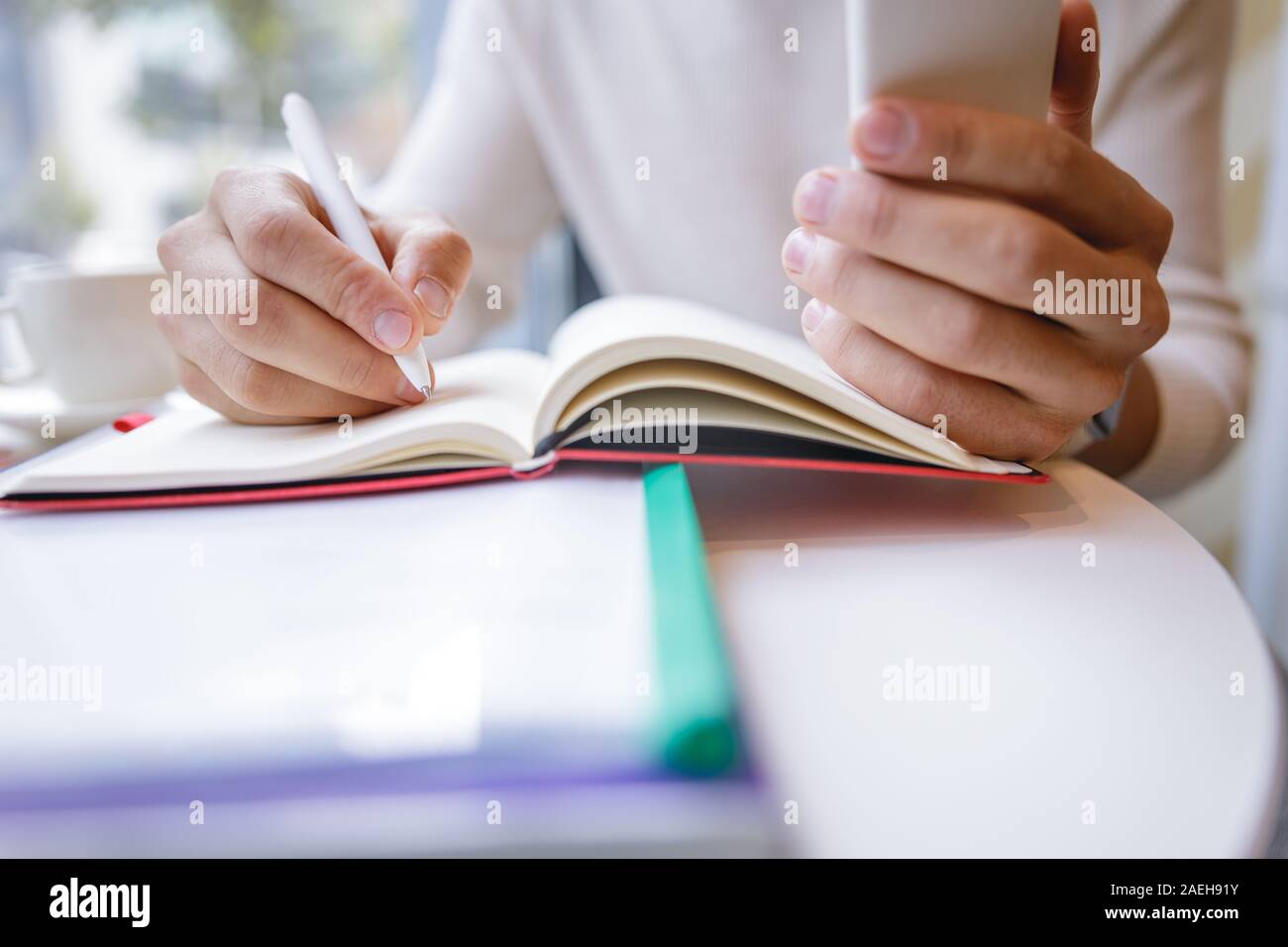 Close up of male hands that making notes Stock Photo