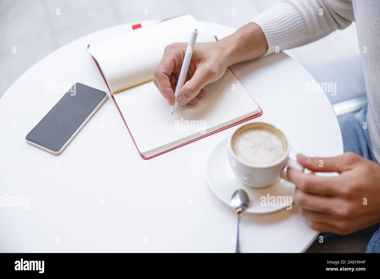 Focused photo on male hand that making notes Stock Photo