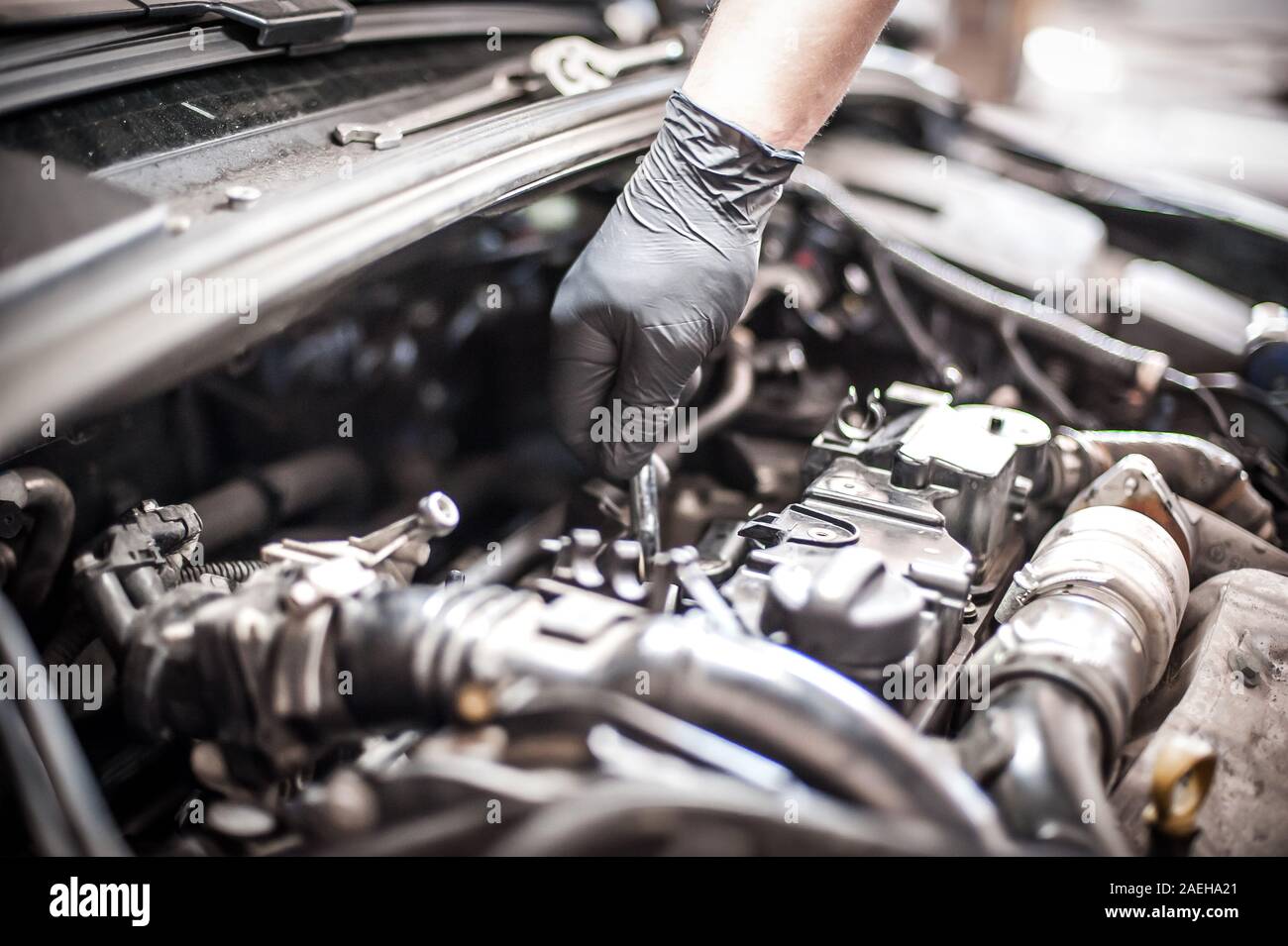 Removing and changing valves. Car mechanic checking automobile valves