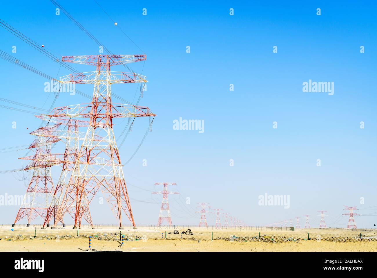 High voltage overhead transmission lines in Abu Dhabi desert Stock