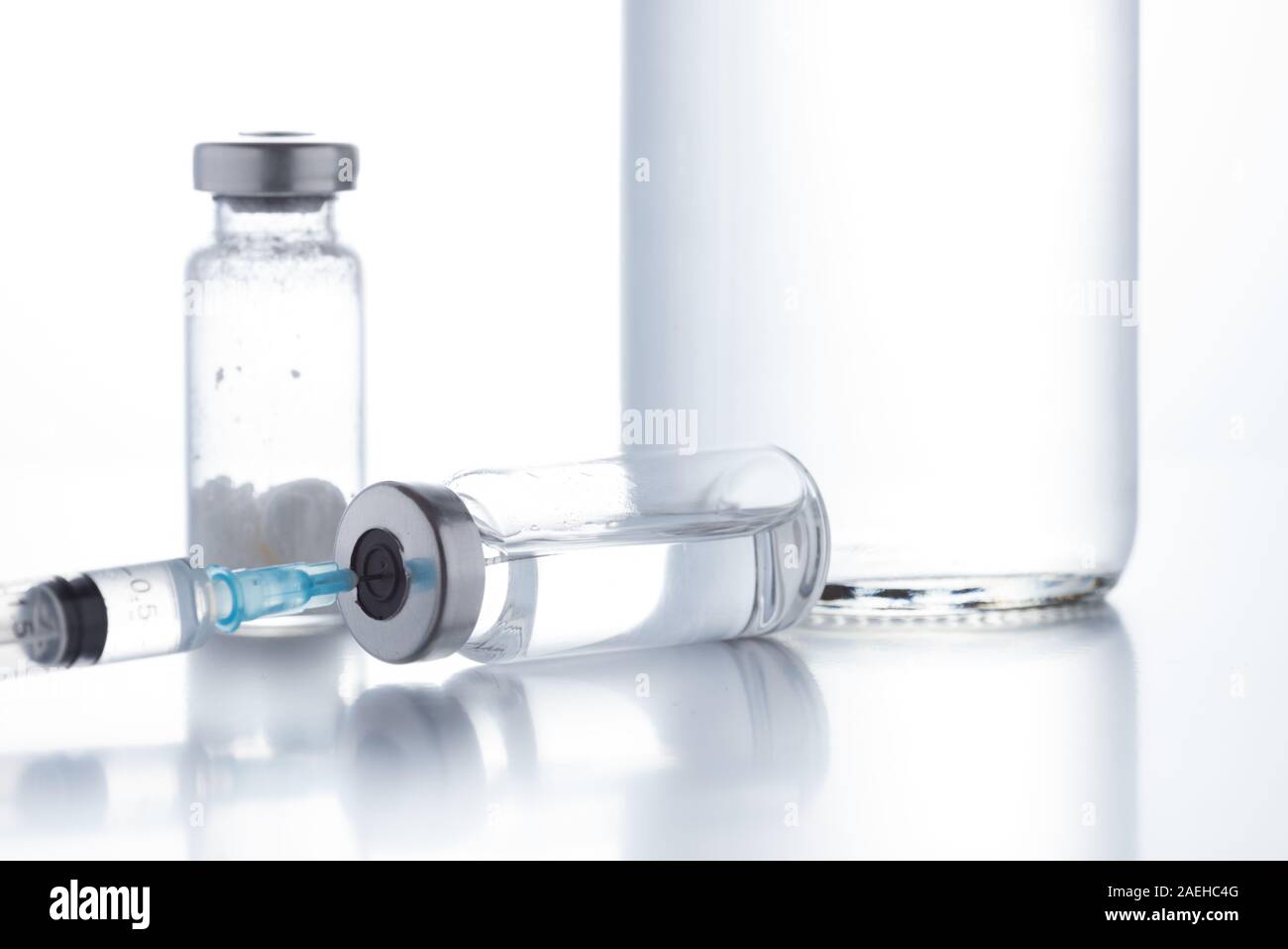 Antibiotic injection bottles with a plastic disposable syringe on a ...