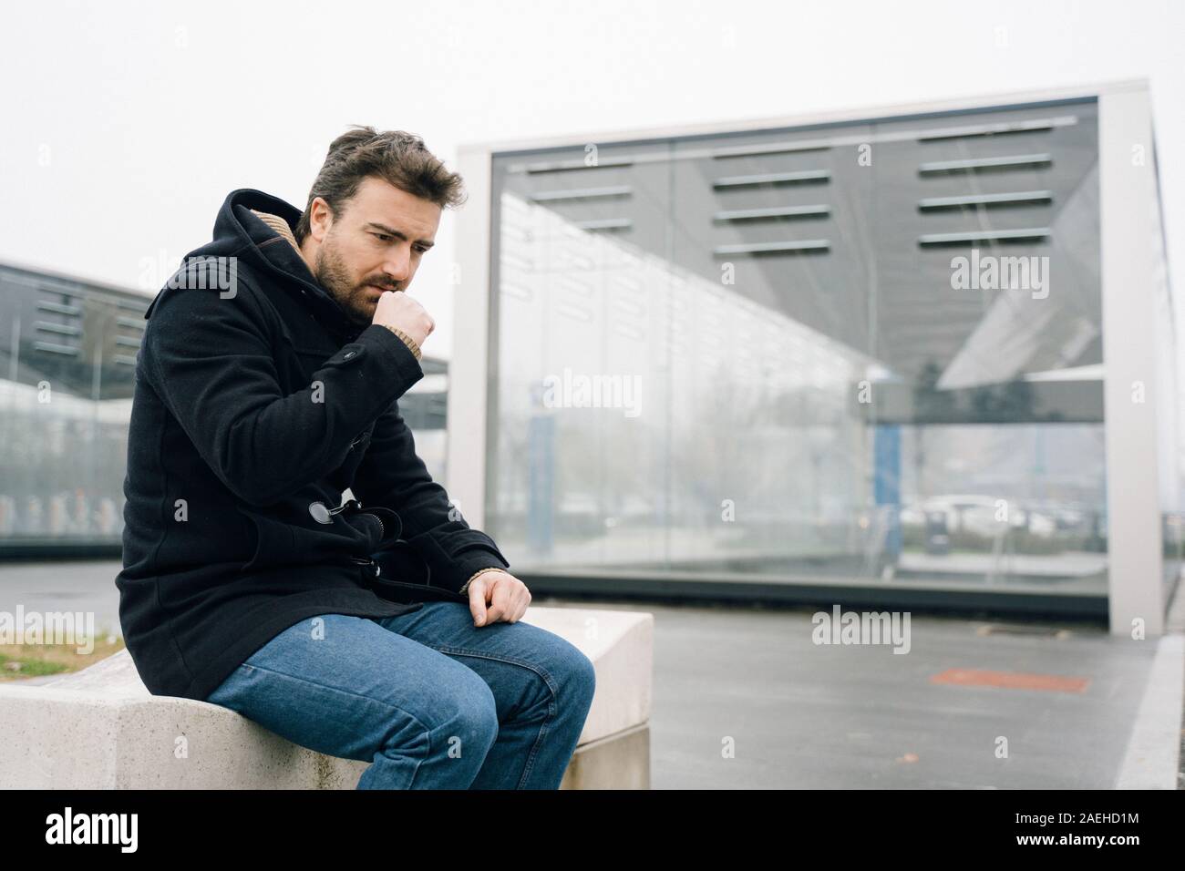 Man coughing and suffering in cold weather Stock Photo