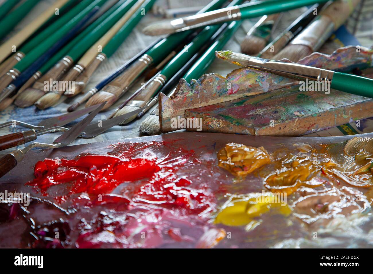 artists paint palette with brushes and oils Stock Photo