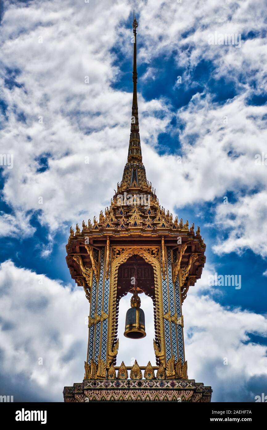 Bangkok, Thailand 11.24.2019: A Thai traditional bell tower (belfry) with detailed, mosaic artwork and gold colored design at Wat Phra Kaew (Temple of Stock Photo