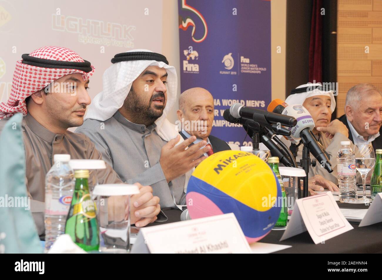 Farwaniya Governorate, Kuwait. 9th Dec, 2019. Sheikh Khaled Al-Bader Al-Sabah (2nd L), Head of the Kuwait and Asian Swimming Sports Federations, speaks at a press conference in Farwaniya Governorate, Kuwait, Dec. 9, 2019. Kuwait will host the 20th FINA World Men's Junior Water Polo Championships from Dec.12 to 20. Credit: Ghazy Qaffaf/Xinhua/Alamy Live News Stock Photo