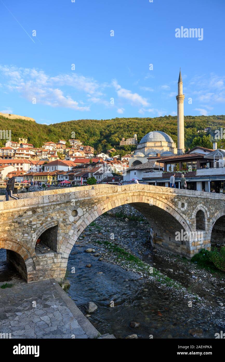 Looking across to The old town of Prizren and The Sinan Pasha Mosque from the stone bridge across the Bistrica river. in Kosovo, central Balkans. Stock Photo