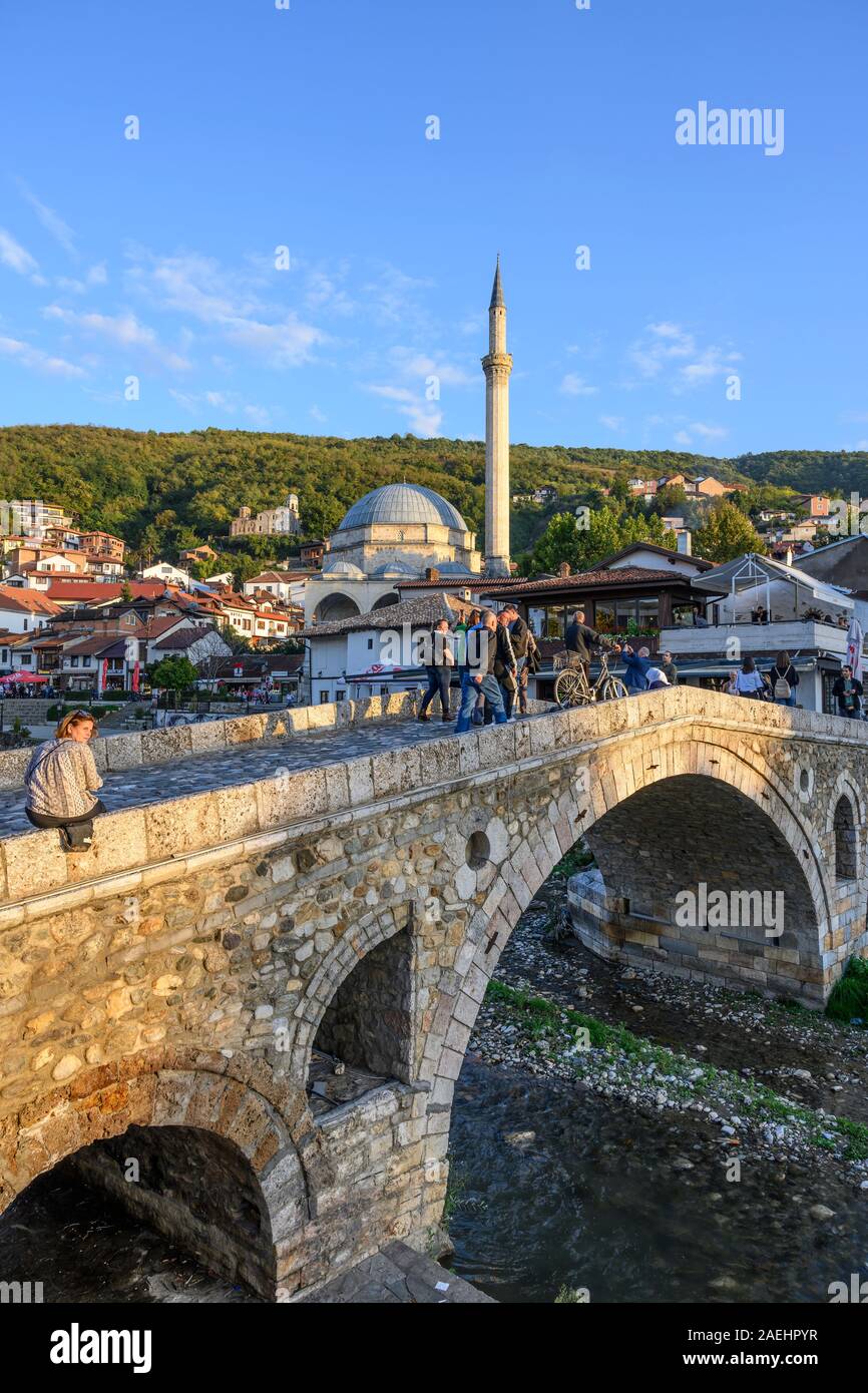 Looking across to The old town of Prizren and The Sinan Pasha Mosque from the stone bridge across the Bistrica river. in Kosovo, central Balkans. Stock Photo