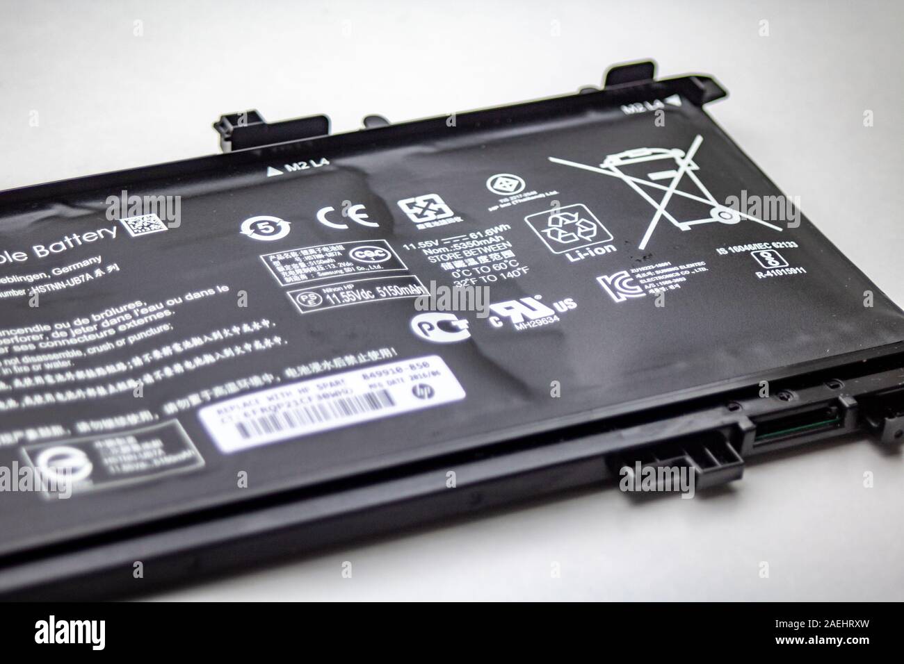 Heidelberg, Germany - August 02, 2019: Replacement of a defect, bloated HP Notebook Lithium-ion battery Stock Photo