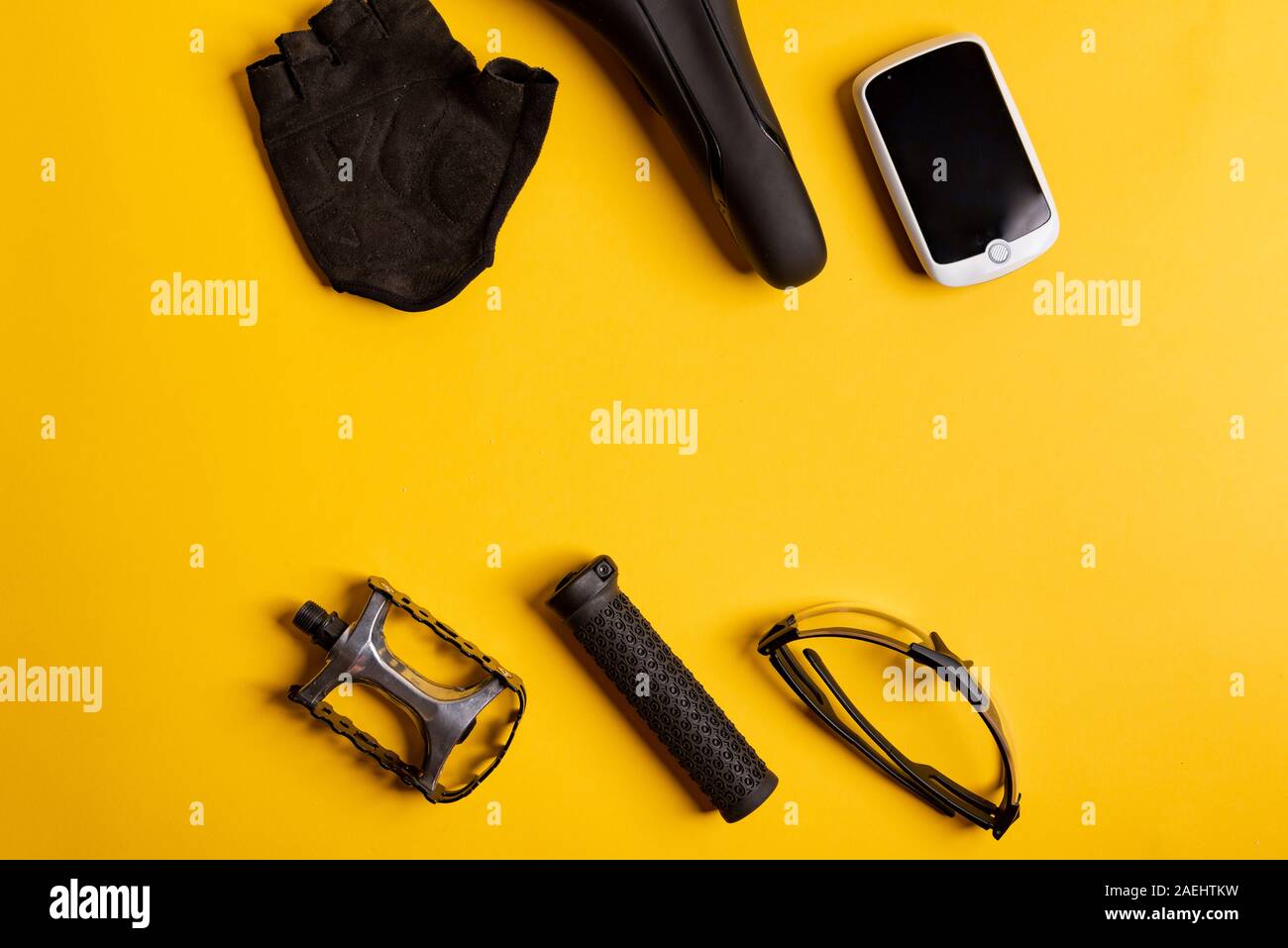 Bicycle, Cycling accessories on the yellow background. view from above Stock Photo