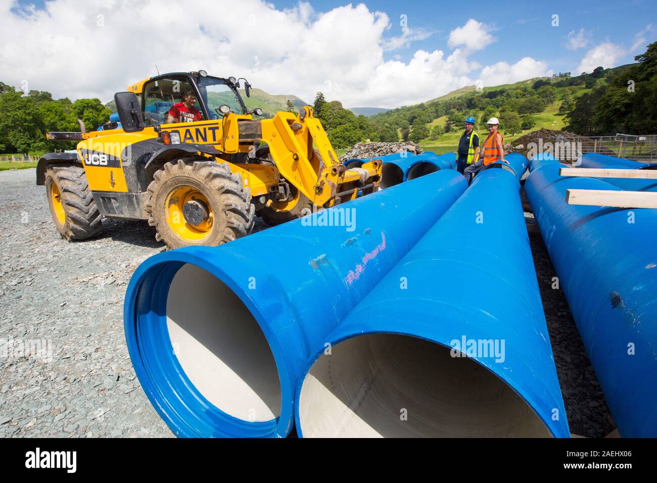 A lorry delivering hydro pipes for the New Rydal Hall Hydro electric scheme, Ambleside, Lake District, UK. Stock Photo