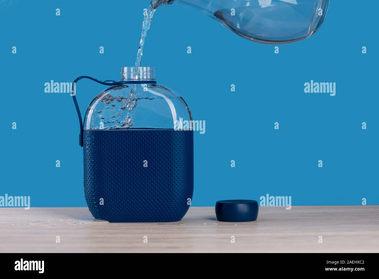 https://c8.alamy.com/comp/2AEHXC2/drinking-water-bottle-hip-flask-being-filled-with-water-2AEHXC2.jpg