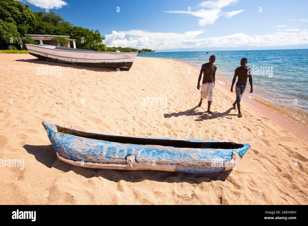 A traditional dug out canoe on a beach at Cape Maclear on the shores of Lake Malawi, Malawi, Africa. Stock Photo